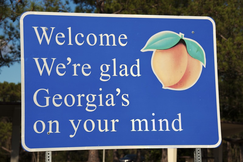 Road sign that reads: 'Welcome We're glad Georgia's on your mind'