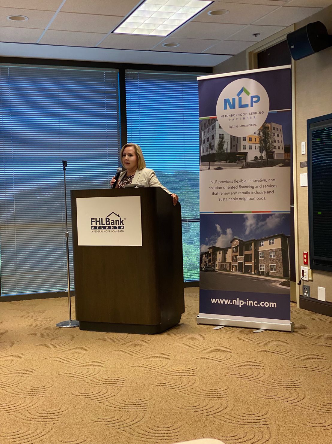 A woman standing behind a podium