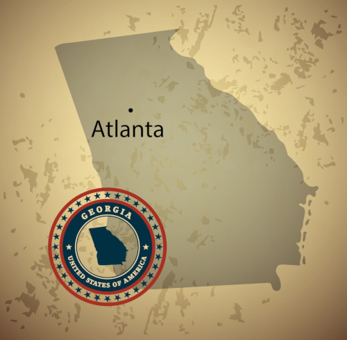 A shadow in the shape of the state of Georgia over a brown and yellowish background, with a black dot showing where Atlanta is