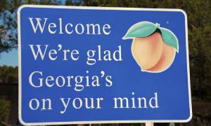 A sign that reads 'Welcome, We're glad Georgia's on your mind'