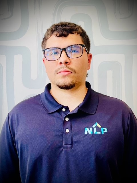 Juan Ramirez, Staff Accountant at Neighborhood Lending Partners, professional business portrait wearing a dark suit jacket